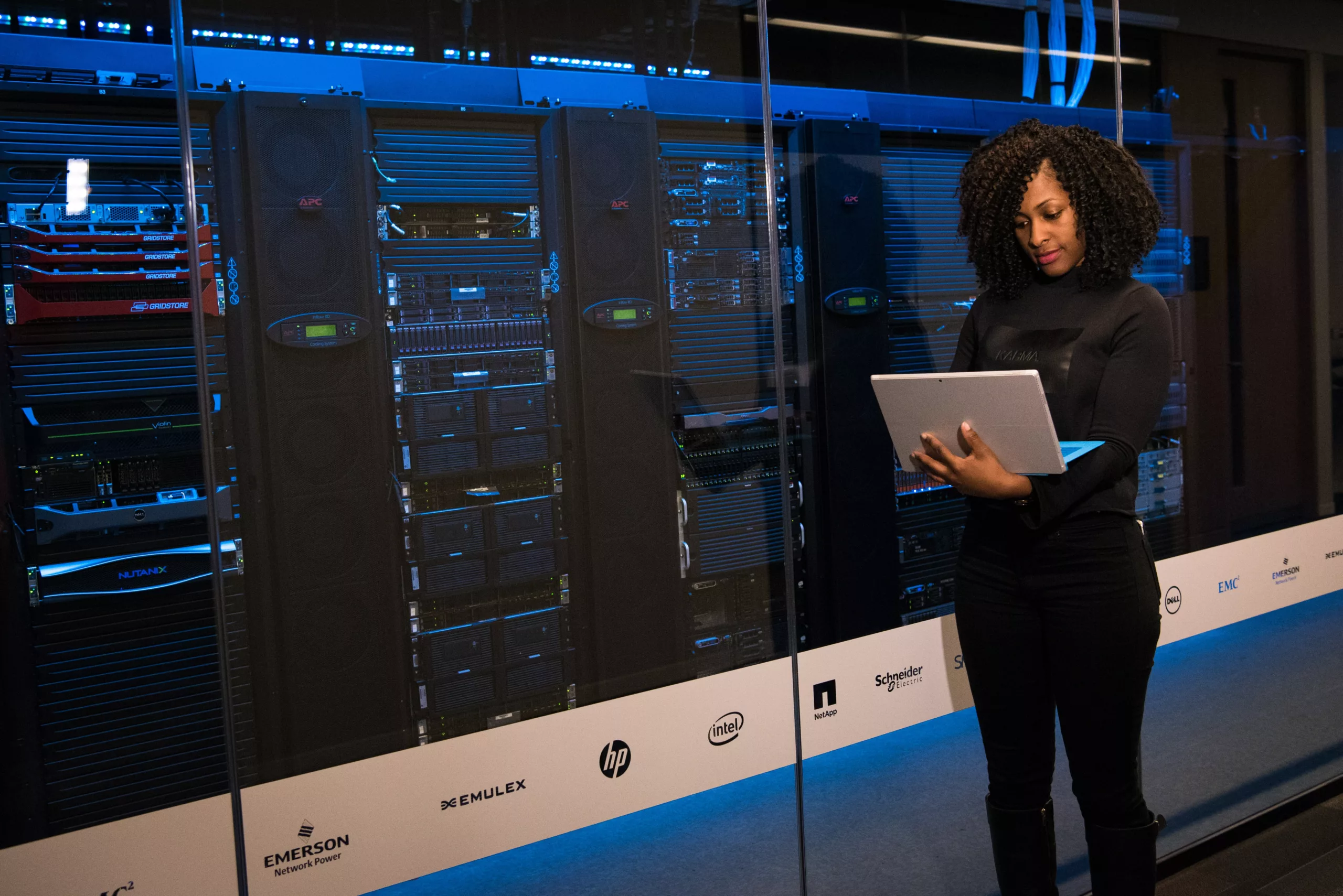 PiscesLED Install Technician optimizing a rack of servers